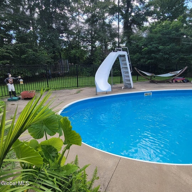 1019 Rose Ave, Guilderland, NY 12303 - view of swimming pool featuring a water slide and view of scattered trees