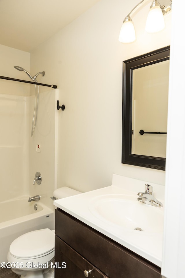 bathroom featuring vanity, toilet, and bathtub / shower combination