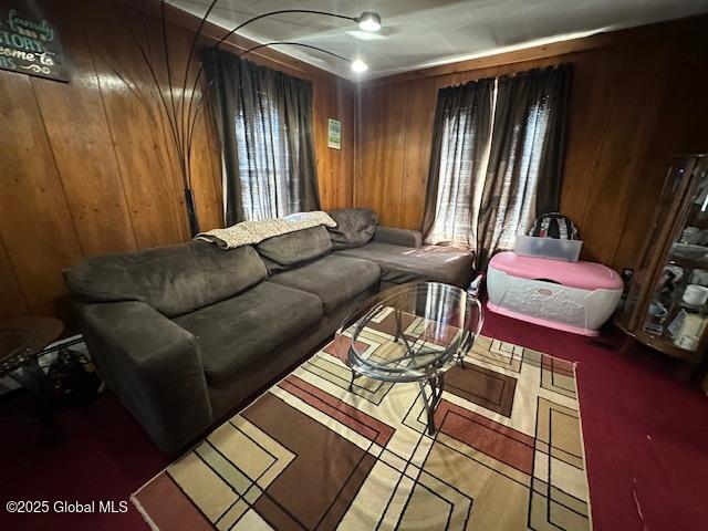 living room with wooden walls