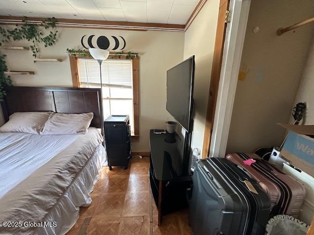 bedroom with crown molding