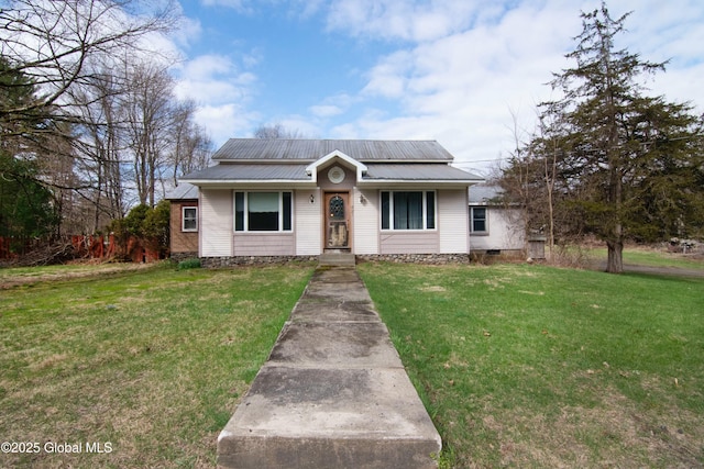 bungalow featuring a front lawn and metal roof