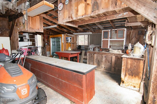 kitchen with unfinished concrete flooring