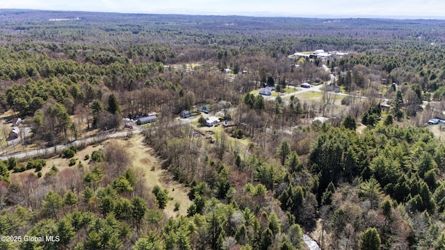 drone / aerial view featuring a forest view