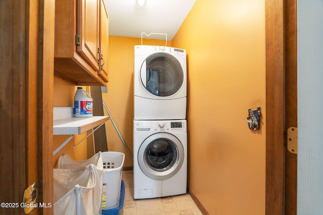 230 Zicha Rd, Esperance, NY 12092 - washroom featuring baseboards, stacked washer and clothes dryer, and cabinet space