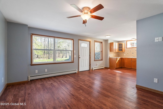 230 Zicha Rd, Esperance, NY 12092 - interior space with baseboards, a baseboard radiator, ceiling fan, and dark wood-type flooring