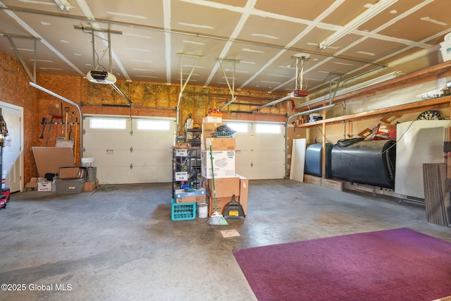 230 Zicha Rd, Esperance, NY 12092 - garage featuring a garage door opener and heating fuel