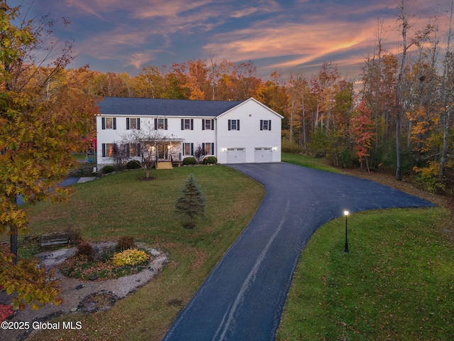 230 Zicha Rd, Esperance, NY 12092 - traditional home with an attached garage, driveway, and a front lawn