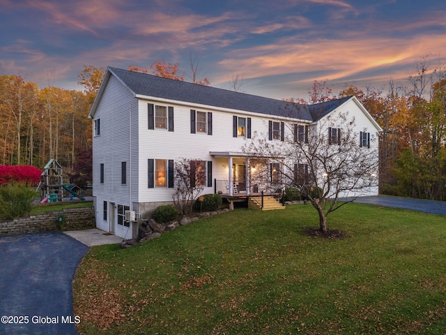 230 Zicha Rd, Esperance, NY 12092 - view of front of property with a porch, driveway, a front yard, and a garage