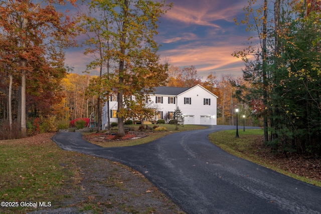 230 Zicha Rd, Esperance, NY 12092 - traditional home with an attached garage, a front lawn, and aphalt driveway
