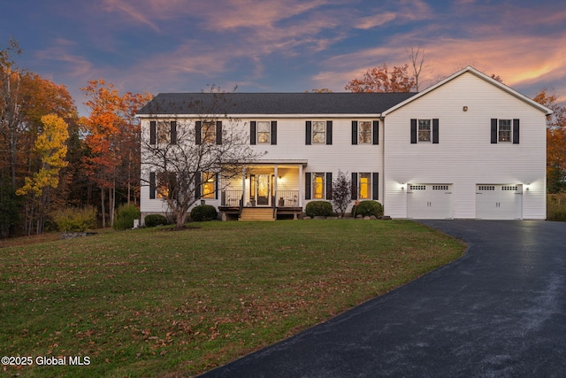 230 Zicha Rd, Esperance, NY 12092 - colonial-style house with a lawn, an attached garage, driveway, and covered porch