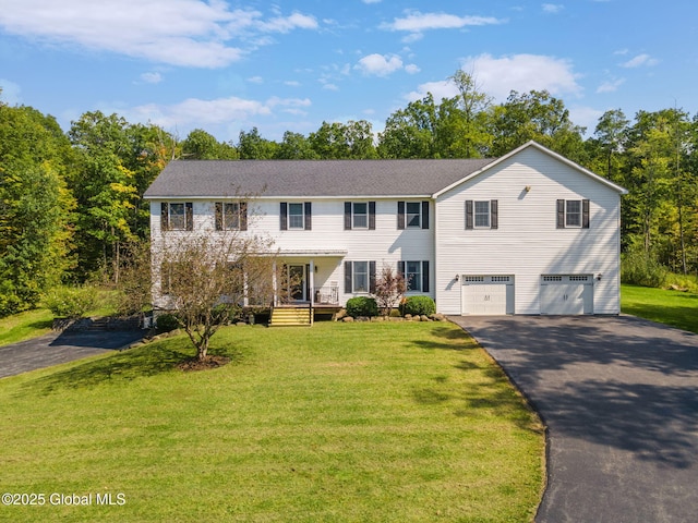 230 Zicha Rd, Esperance, NY 12092 - colonial-style house with covered porch, driveway, a front lawn, and a garage