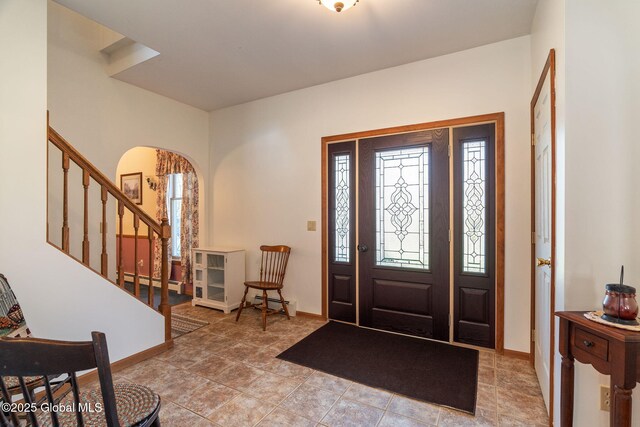 230 Zicha Rd, Esperance, NY 12092 - foyer with baseboards, arched walkways, and stairs
