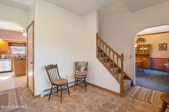 230 Zicha Rd, Esperance, NY 12092 - sitting room with a ceiling fan, arched walkways, baseboard heating, stairway, and light tile patterned floors