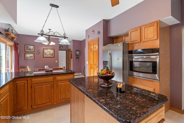 230 Zicha Rd, Esperance, NY 12092 - kitchen with light floors, pendant lighting, dark stone countertops, and appliances with stainless steel finishes