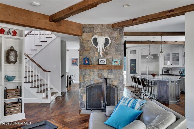 1 Joshua Rd, Saratoga Springs, NY 12866 - living room featuring dark wood-type flooring, stairway, beam ceiling, and baseboards