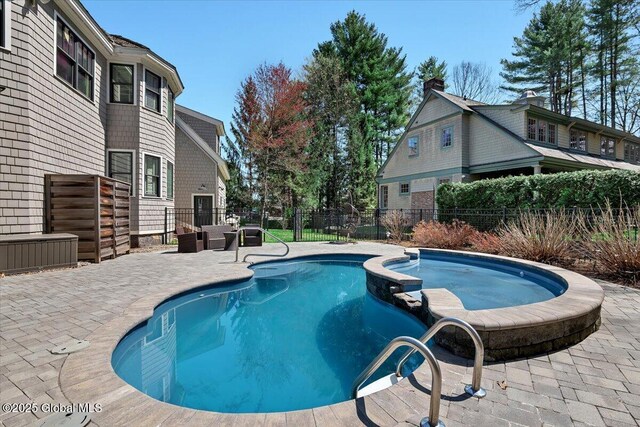 1 Joshua Rd, Saratoga Springs, NY 12866 - view of swimming pool with a patio, a pool with connected hot tub, and fence