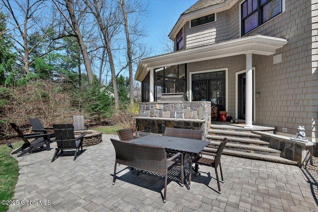 1 Joshua Rd, Saratoga Springs, NY 12866 - view of patio featuring a fire pit and outdoor dining space