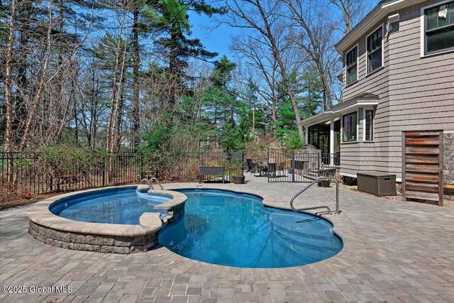 1 Joshua Rd, Saratoga Springs, NY 12866 - view of pool featuring fence, a patio area, and a pool with connected hot tub