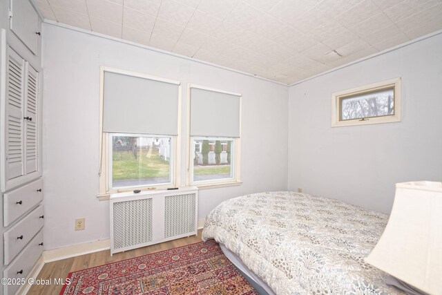 1823 8th St, Rensselaer, NY 12144 - bedroom featuring wood finished floors and radiator