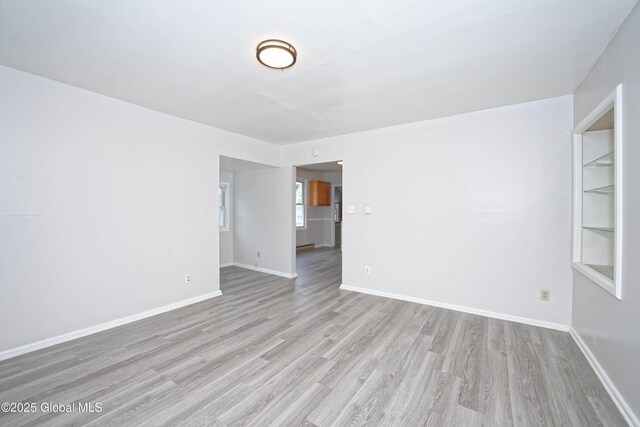 1823 8th St, Rensselaer, NY 12144 - spare room with wood finished floors and baseboards