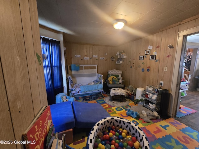 bedroom with wooden walls