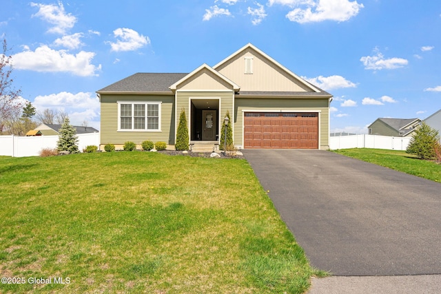 6 Gorsline Dr, Halfmoon, NY 12118 - view of front of property with fence, an attached garage, a front lawn, and aphalt driveway