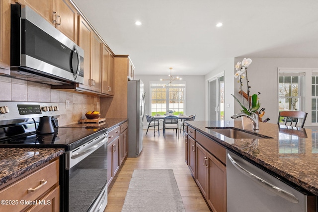 6 Gorsline Dr, Halfmoon, NY 12118 - kitchen featuring light wood-style flooring, a sink, recessed lighting, a notable chandelier, and appliances with stainless steel finishes