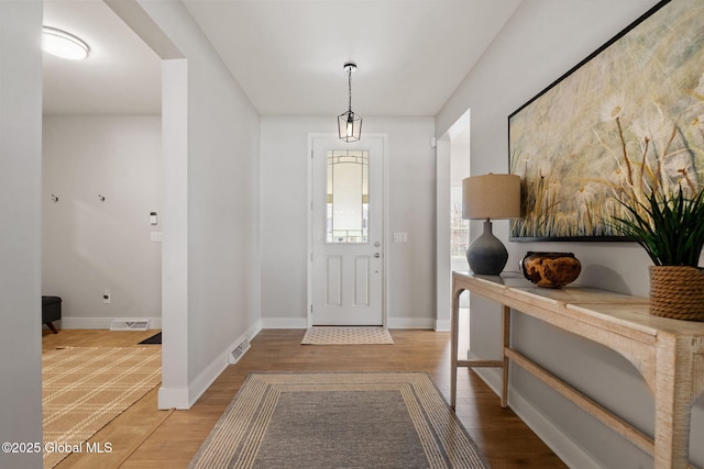 6 Gorsline Dr, Halfmoon, NY 12118 - entryway featuring wood finished floors, visible vents, and baseboards