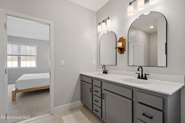 6 Gorsline Dr, Halfmoon, NY 12118 - bathroom featuring double vanity, tile patterned floors, baseboards, and a sink