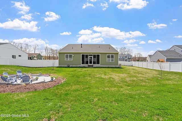 6 Gorsline Dr, Halfmoon, NY 12118 - rear view of property featuring a fenced backyard, a yard, and an outdoor fire pit