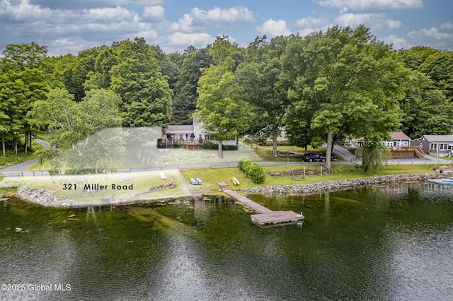 dock area featuring a water view and a wooded view