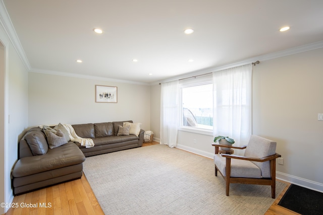 living area featuring recessed lighting, baseboards, and ornamental molding