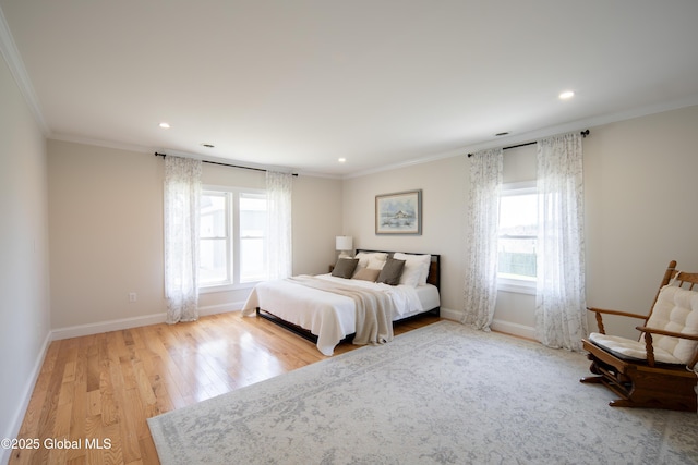 bedroom featuring baseboards, ornamental molding, multiple windows, and recessed lighting