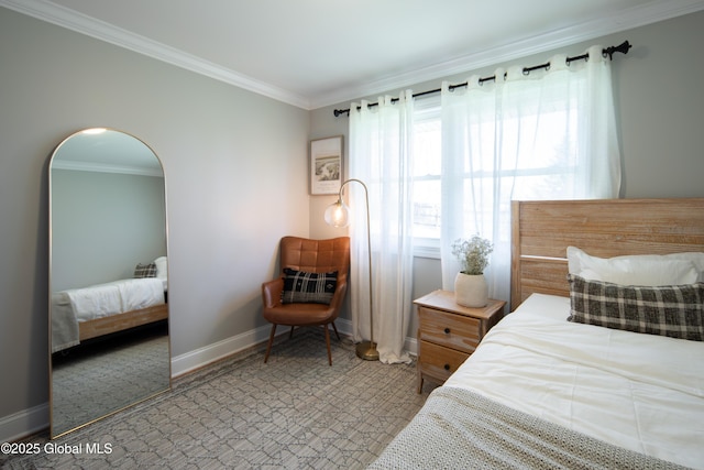 bedroom featuring baseboards and crown molding