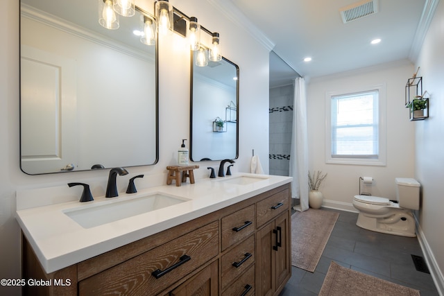 bathroom with visible vents, toilet, baseboards, and a sink