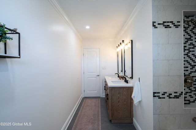 full bath featuring tile patterned floors, a tile shower, baseboards, vanity, and ornamental molding