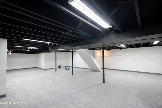 finished basement featuring carpet and baseboards