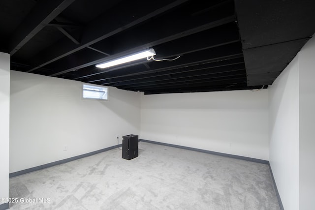 basement with carpet and baseboards