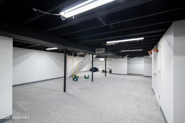 finished below grade area featuring carpet floors and baseboards