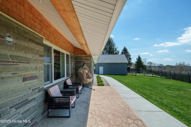 view of patio / terrace featuring fence