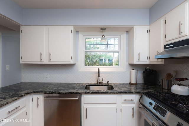 kitchen with a sink, white cabinetry, appliances with stainless steel finishes, and backsplash