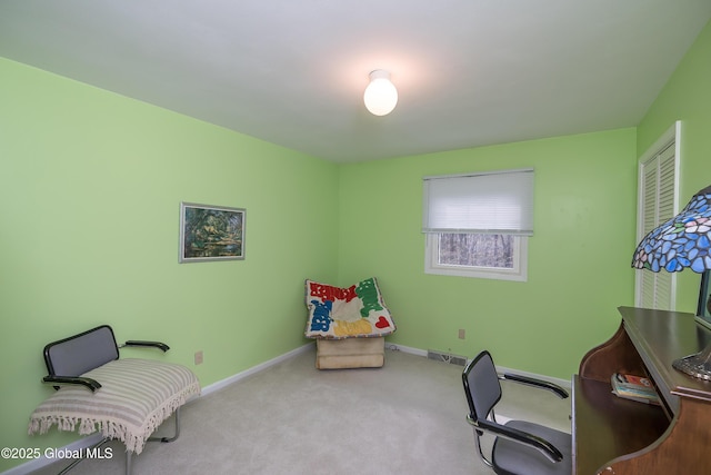 carpeted home office with baseboards and visible vents