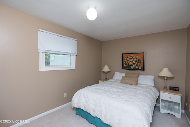 carpeted bedroom with baseboards
