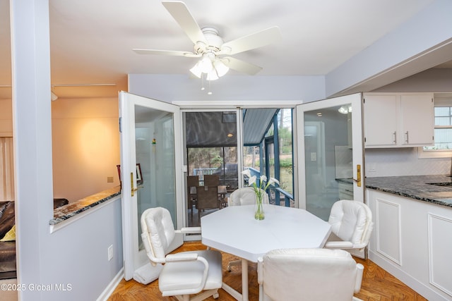 dining room with ceiling fan and a healthy amount of sunlight