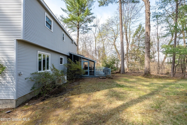 view of yard featuring a sunroom