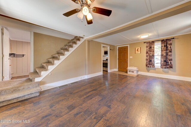 unfurnished living room featuring visible vents, baseboards, wood finished floors, stairs, and ceiling fan