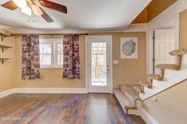 doorway to outside featuring baseboards, wood finished floors, stairs, and ceiling fan