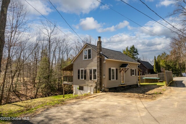 view of home's exterior with a chimney