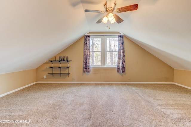 bonus room featuring vaulted ceiling, carpet, baseboards, and ceiling fan