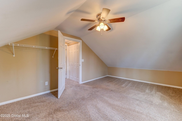 additional living space featuring ceiling fan, carpet floors, lofted ceiling, and baseboards